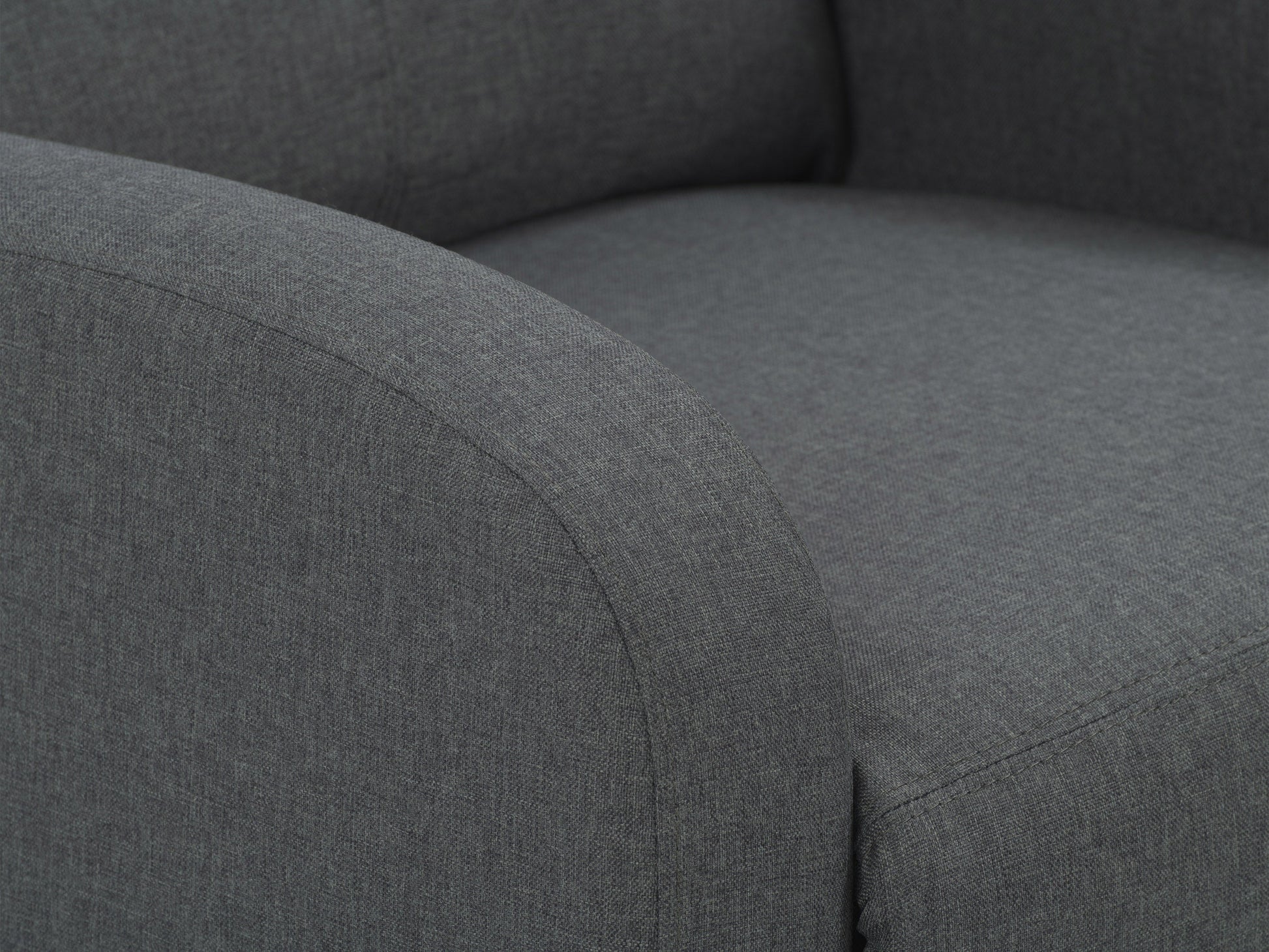 Dark grey push back recliner with plush cushions, wooden legs, and sleek modern design.