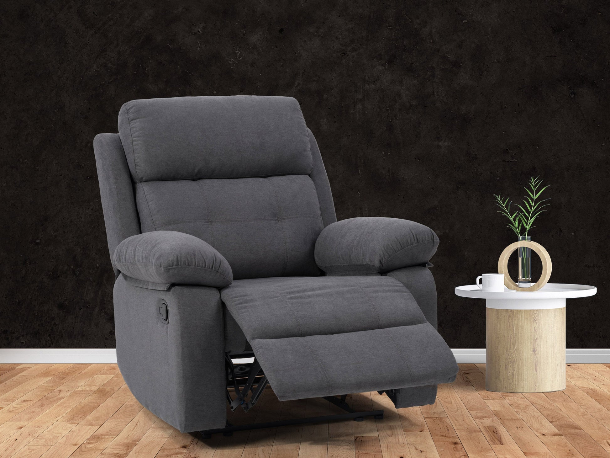 Dark grey extra wide recliner with plush cushions and sleek design, perfect for modern living rooms.