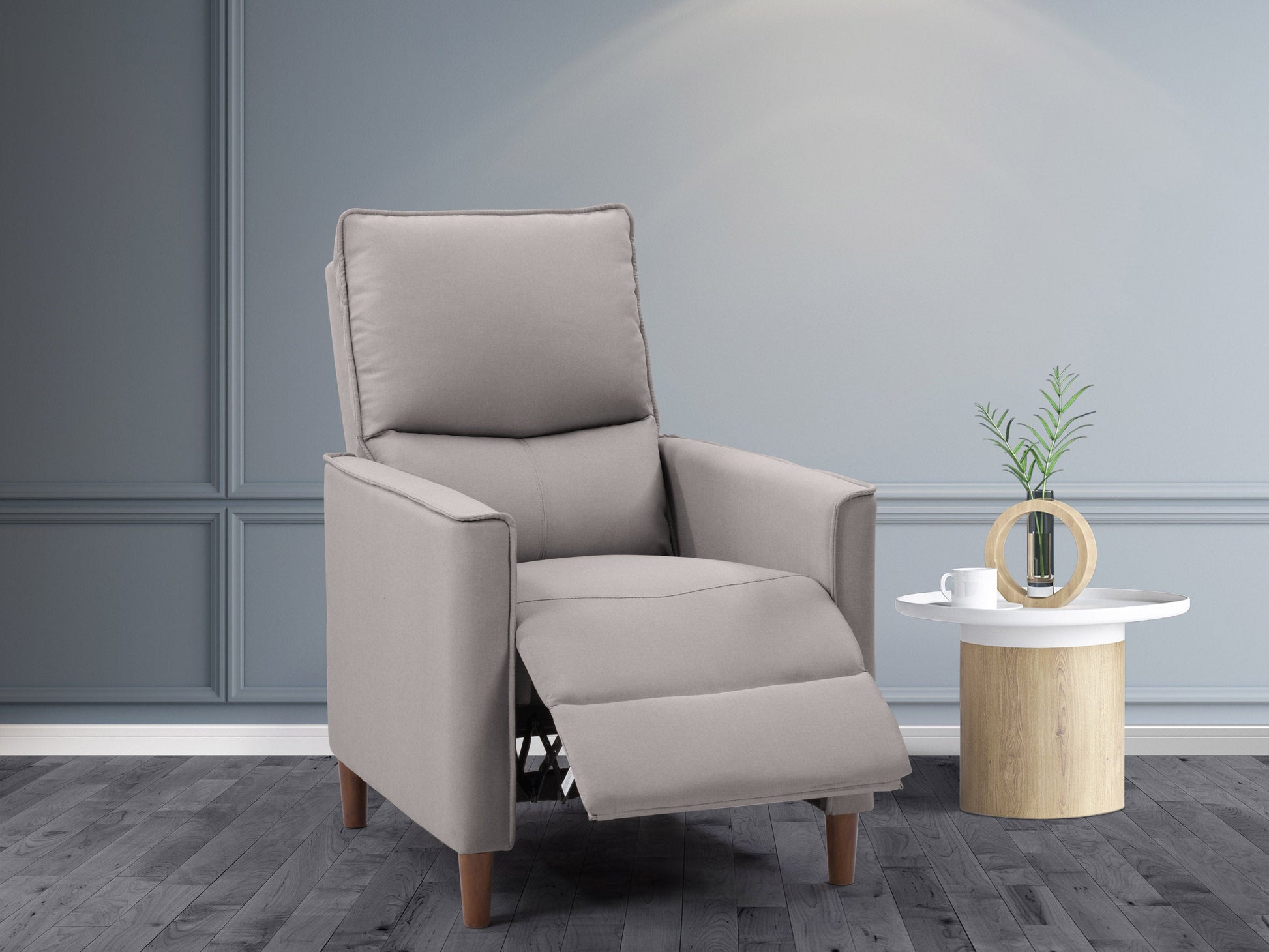 Light grey mid-century recliner with tufted backrest, wooden legs, and plush fabric upholstery.