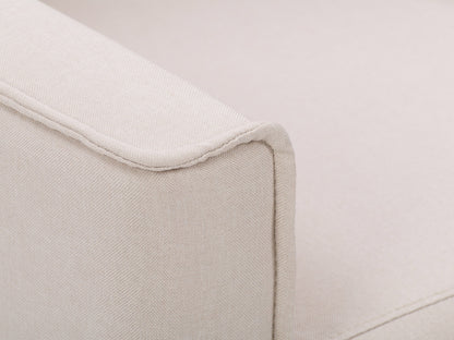 Beige mid-century recliner with wooden legs, tufted backrest, and sleek armrests.