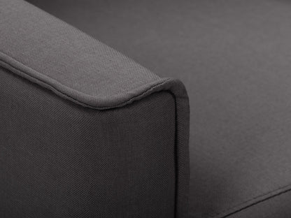 Dark grey mid-century recliner with wooden legs, tufted backrest, and soft fabric upholstery.
