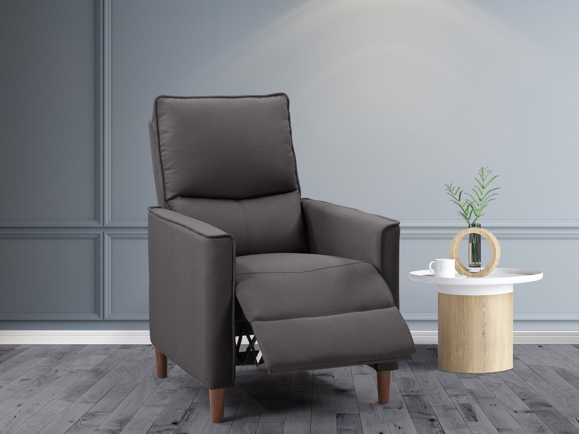 Dark grey mid-century recliner with wooden legs and tufted backrest, perfect for modern living rooms.