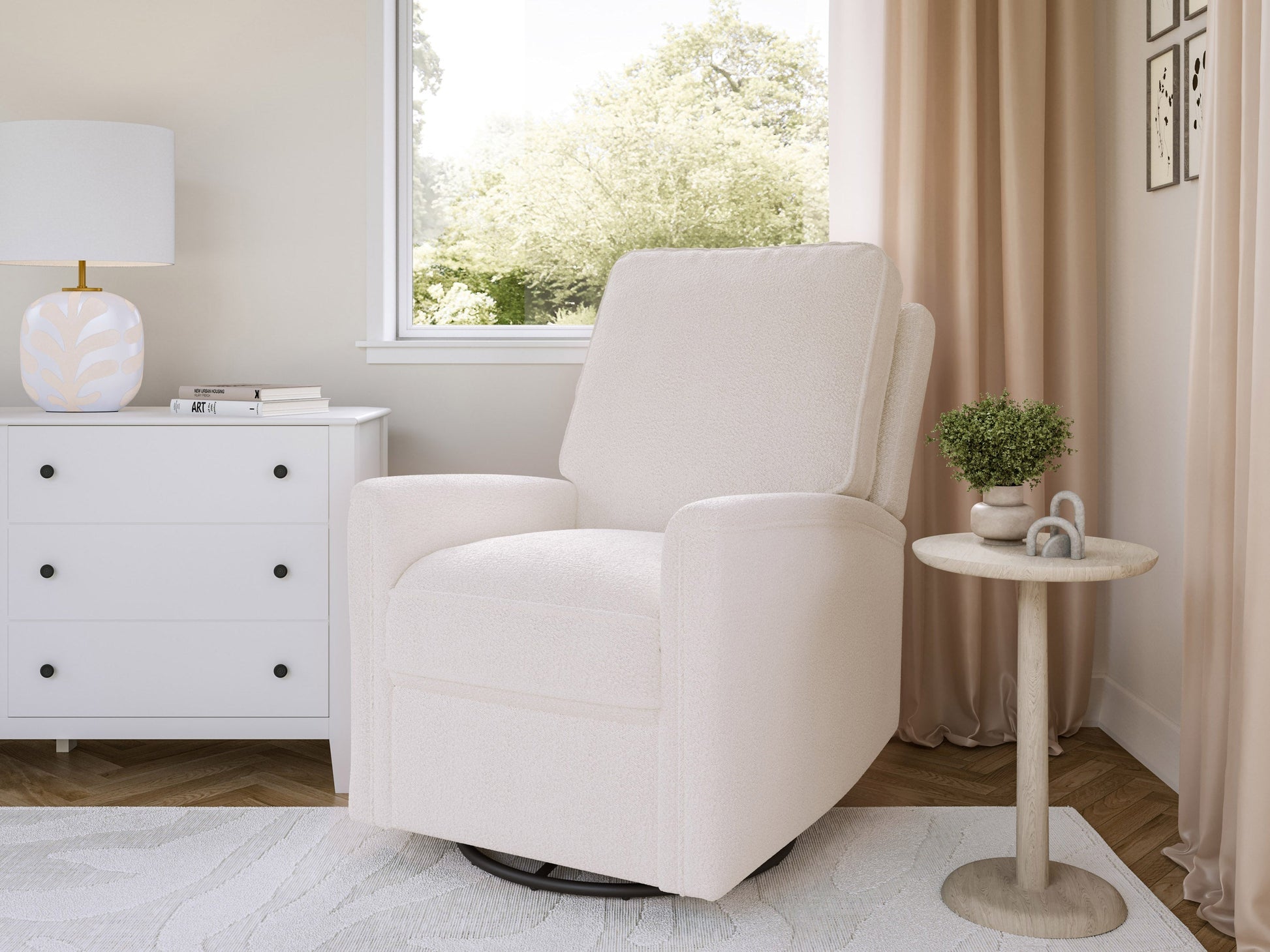 Boucle swivel recliner chair in cream fabric with curved design and black metal base.