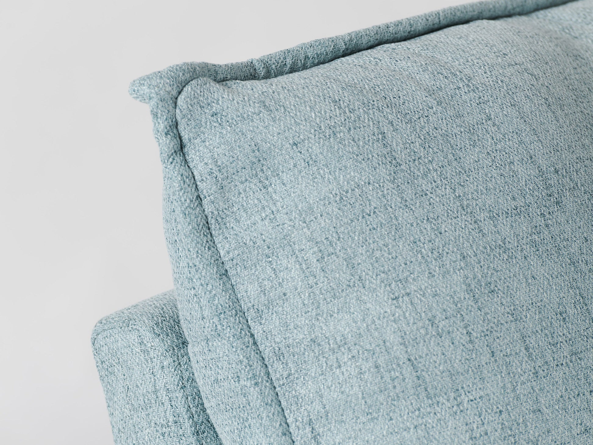 Luxurious grey glider recliner chair with plush fabric upholstery, ergonomic design, and smooth reclining mechanism.