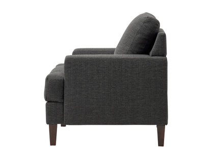 Mid-century dark grey armchair with wooden legs, fabric upholstery, and tufted backrest.