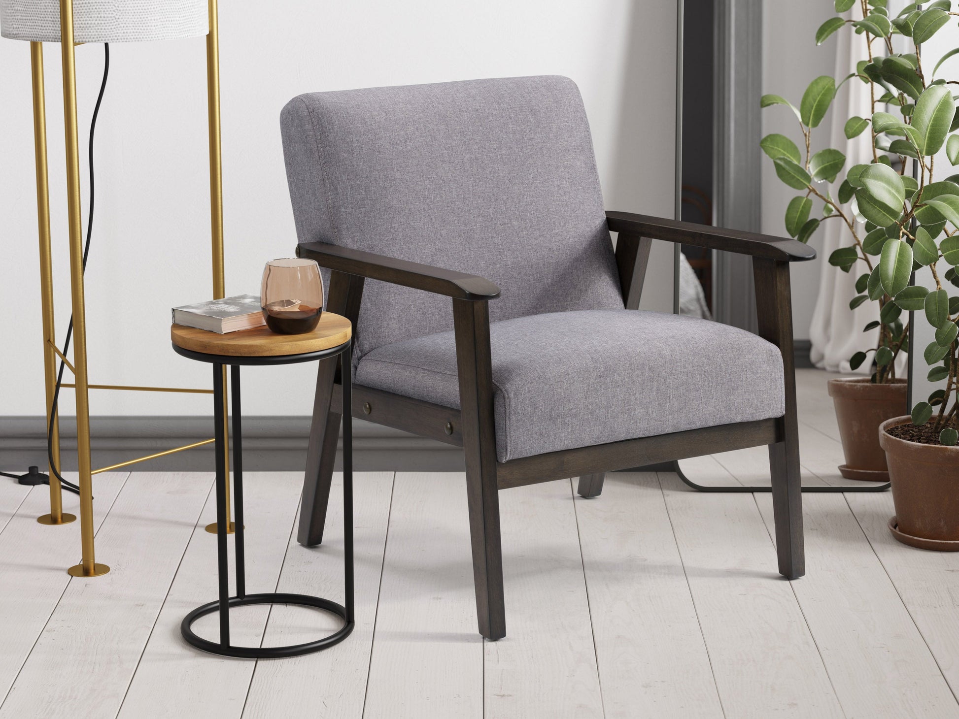 Grey wood accent chair with cushioned seat and backrest, mid-century modern design, and sleek wooden legs.