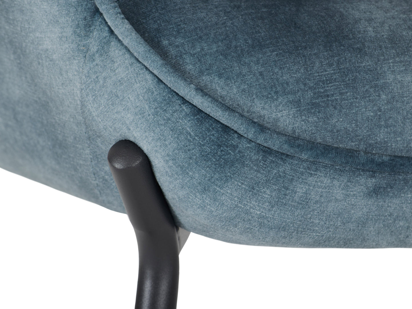 Dark teal velvet accent chair with matching stool, featuring a sleek design and wooden legs.