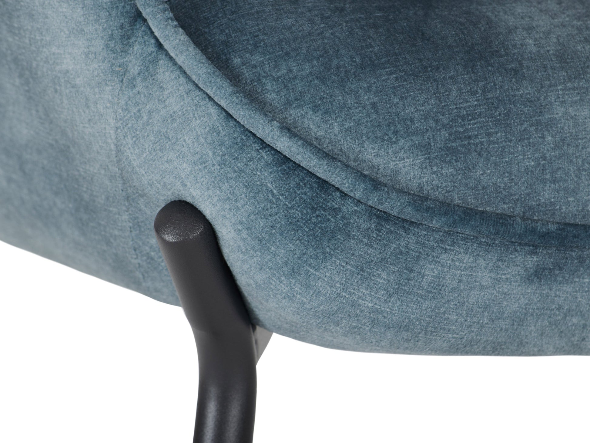 Dark teal velvet accent chair with matching stool, featuring a sleek design and wooden legs.