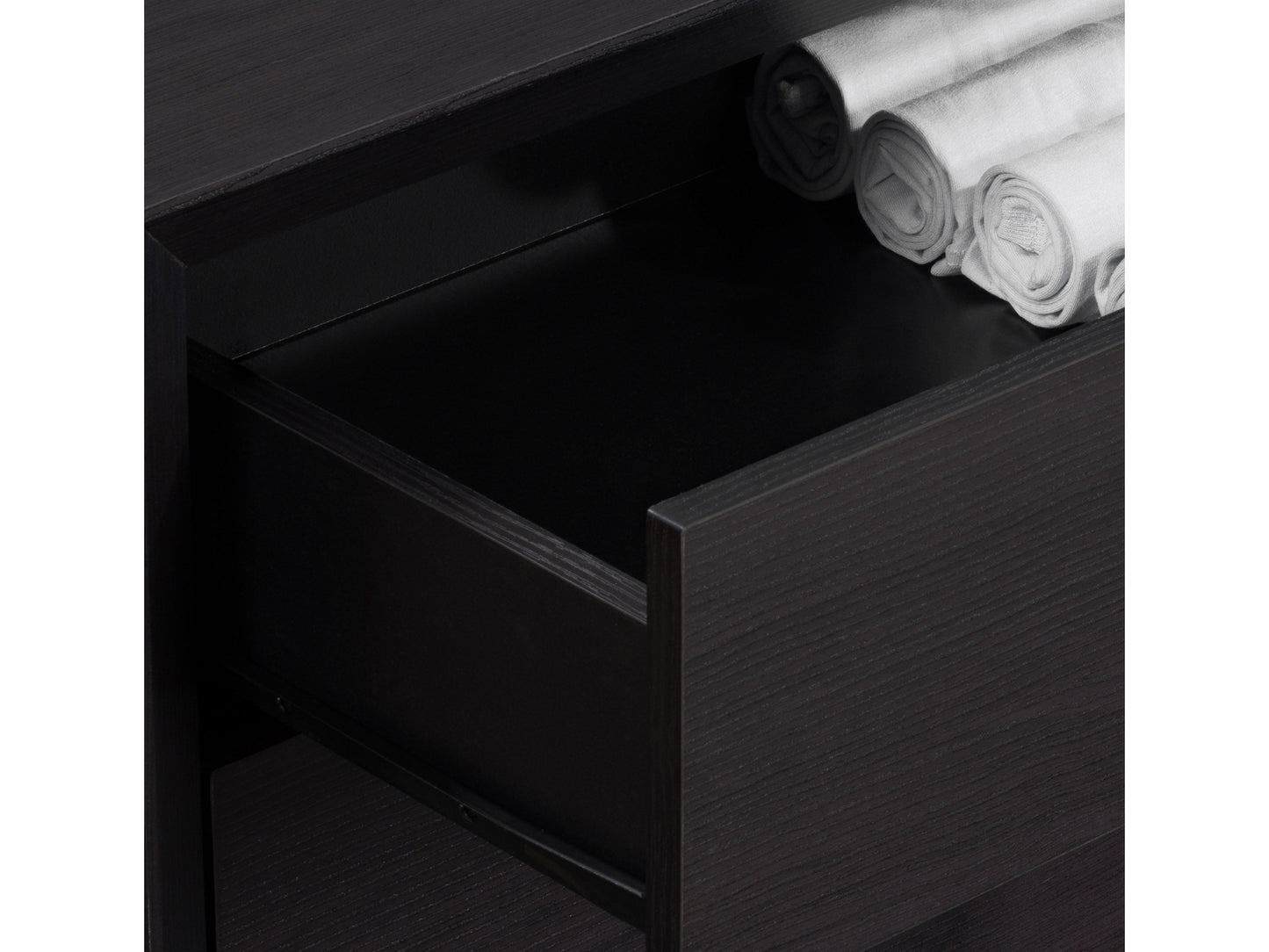 Tall black bedroom dresser with five spacious drawers, sleek metal handles, and a modern minimalist design.