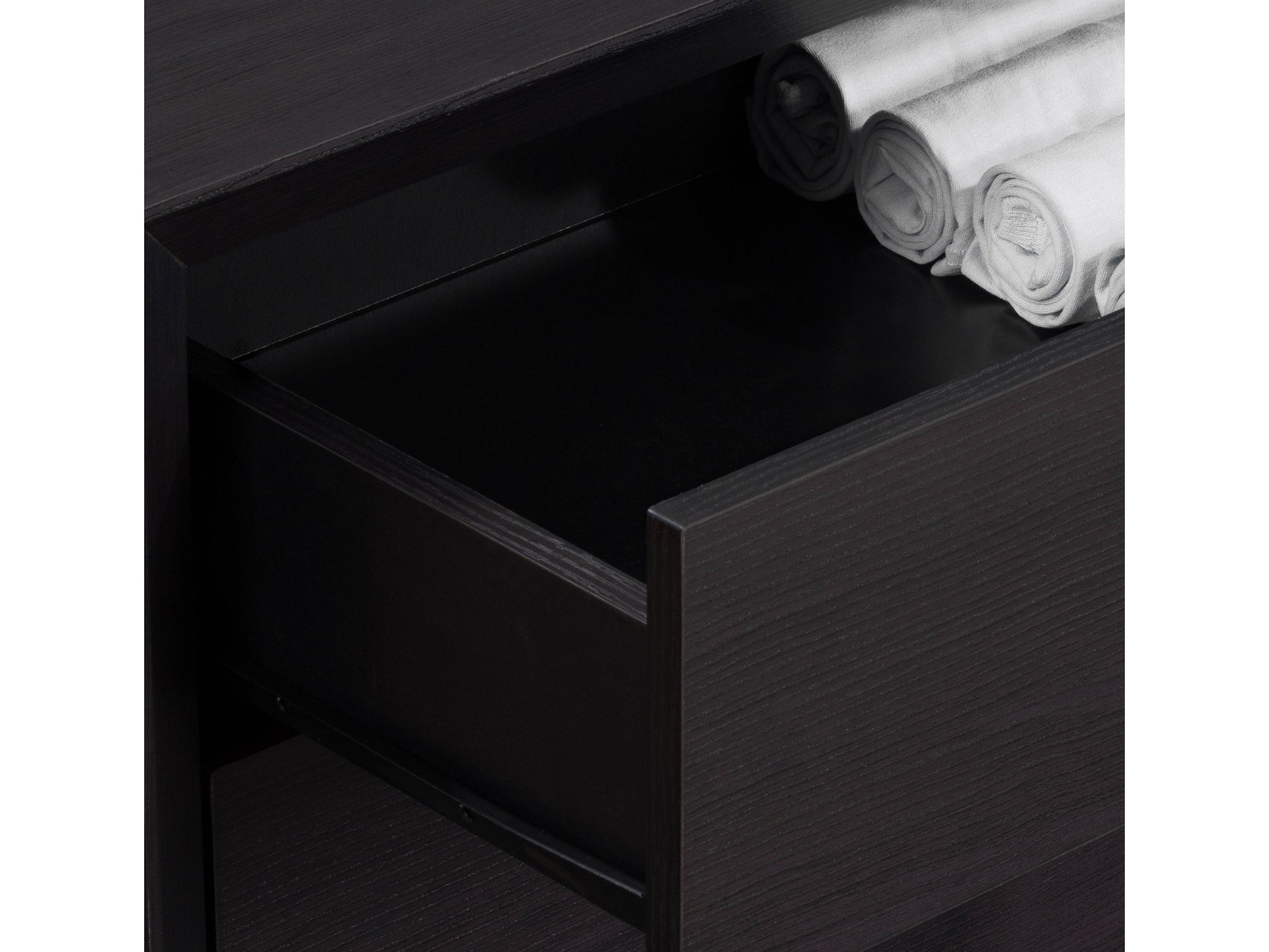 Tall black bedroom dresser with five spacious drawers, sleek metal handles, and a modern minimalist design.