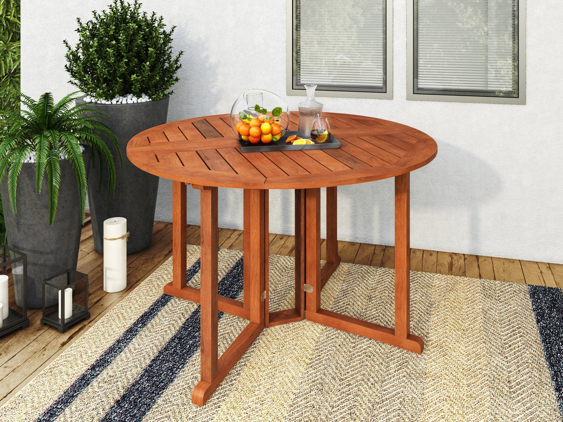 Brown outdoor drop leaf patio table with a slatted wooden surface and foldable design for compact storage.