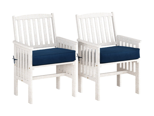 Washed white wooden patio armchair set with slatted backrest and comfortable cushions, perfect for outdoor seating.