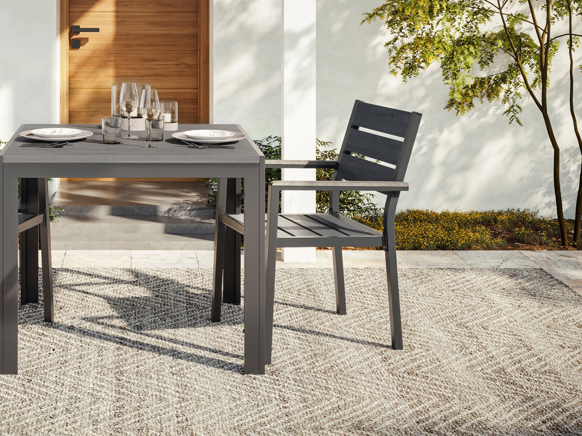 Set of 2 grey patio dining chairs with metal frames and cushioned seats, ideal for outdoor dining.