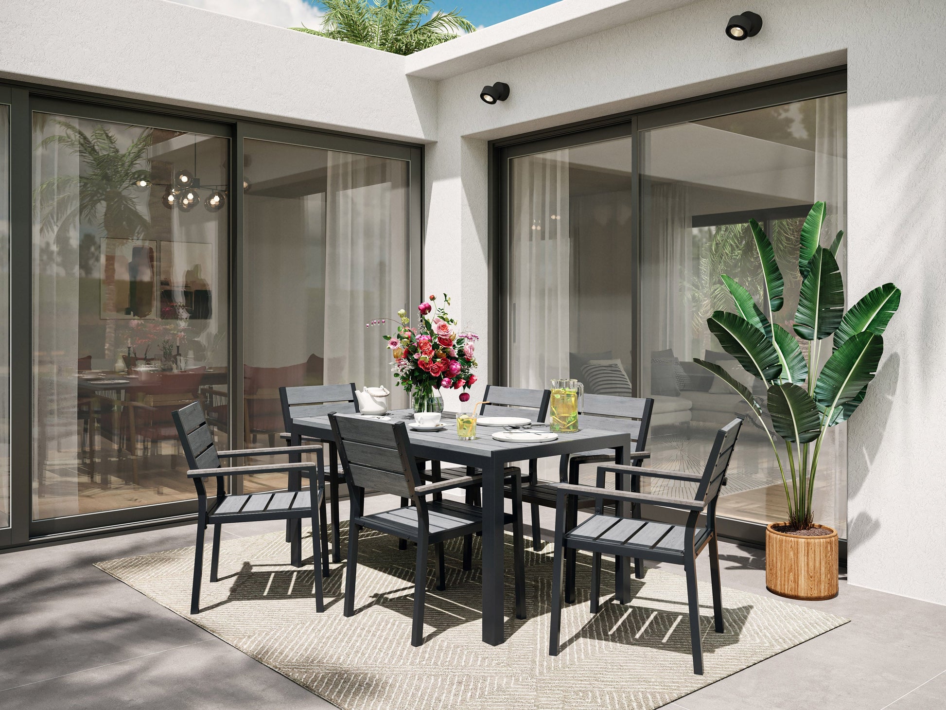 Outdoor 7-piece patio dining set with grey cushions, black metal frame, and wooden accents for modern alfresco dining.