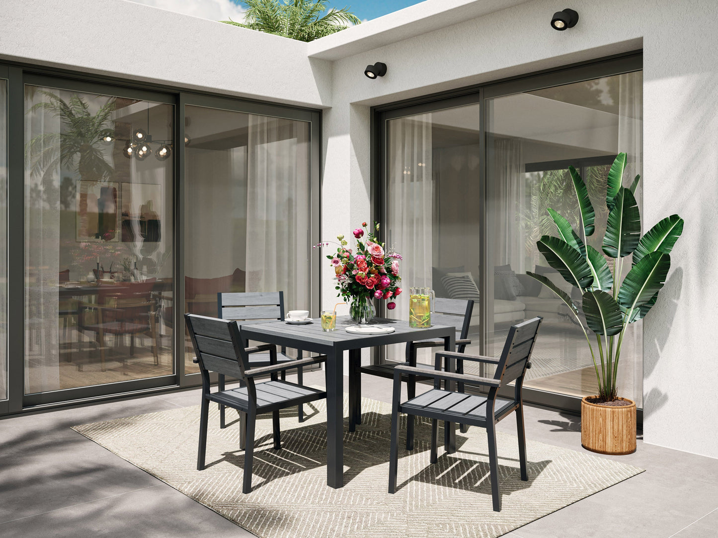 Outdoor dining set, 5pc, grey cushions, sleek black metal frame, rectangular table, modern patio furniture.