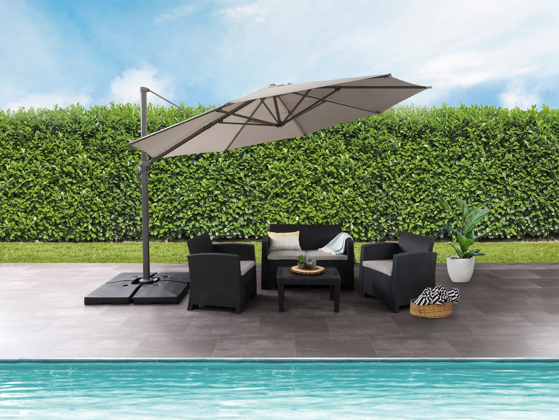 Beige 11.5ft deluxe offset patio umbrella canopy replacement with UV protection, water-resistant fabric, and vented top for optimal airflow. Ideal for outdoor settings, providing shade and durability.