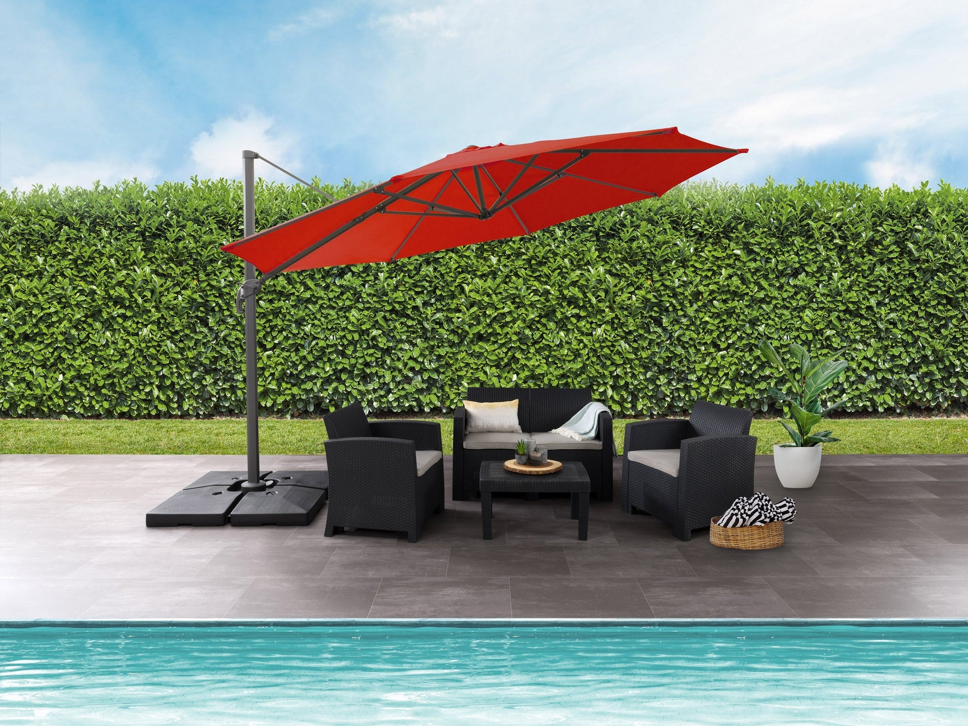 Crimson red 11.5ft deluxe offset patio umbrella with sturdy base and adjustable canopy for outdoor shade.