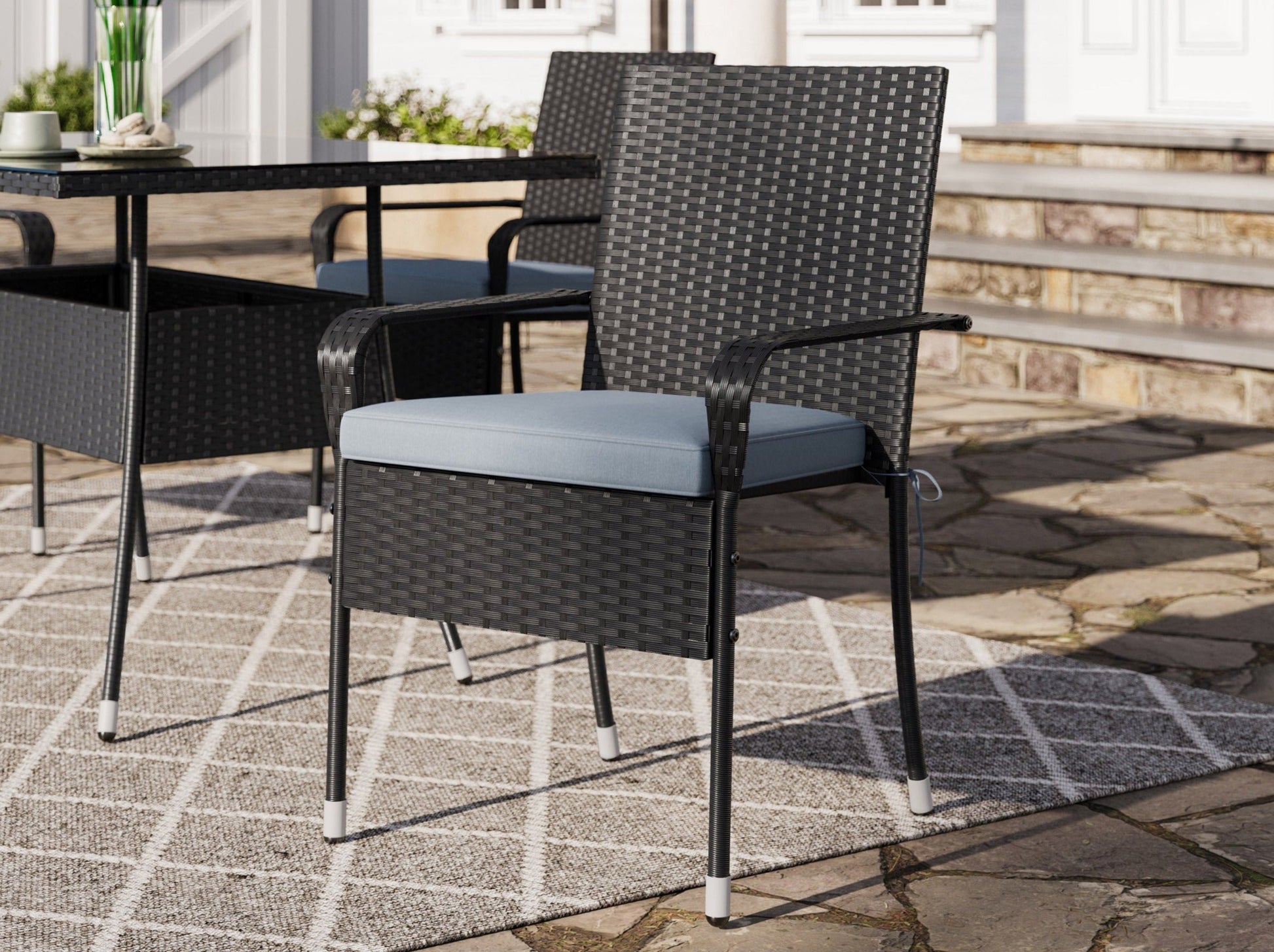 Patio dining set 5pc with grey cushioned chairs, glass-top table, and black metal frame, perfect for outdoor spaces.