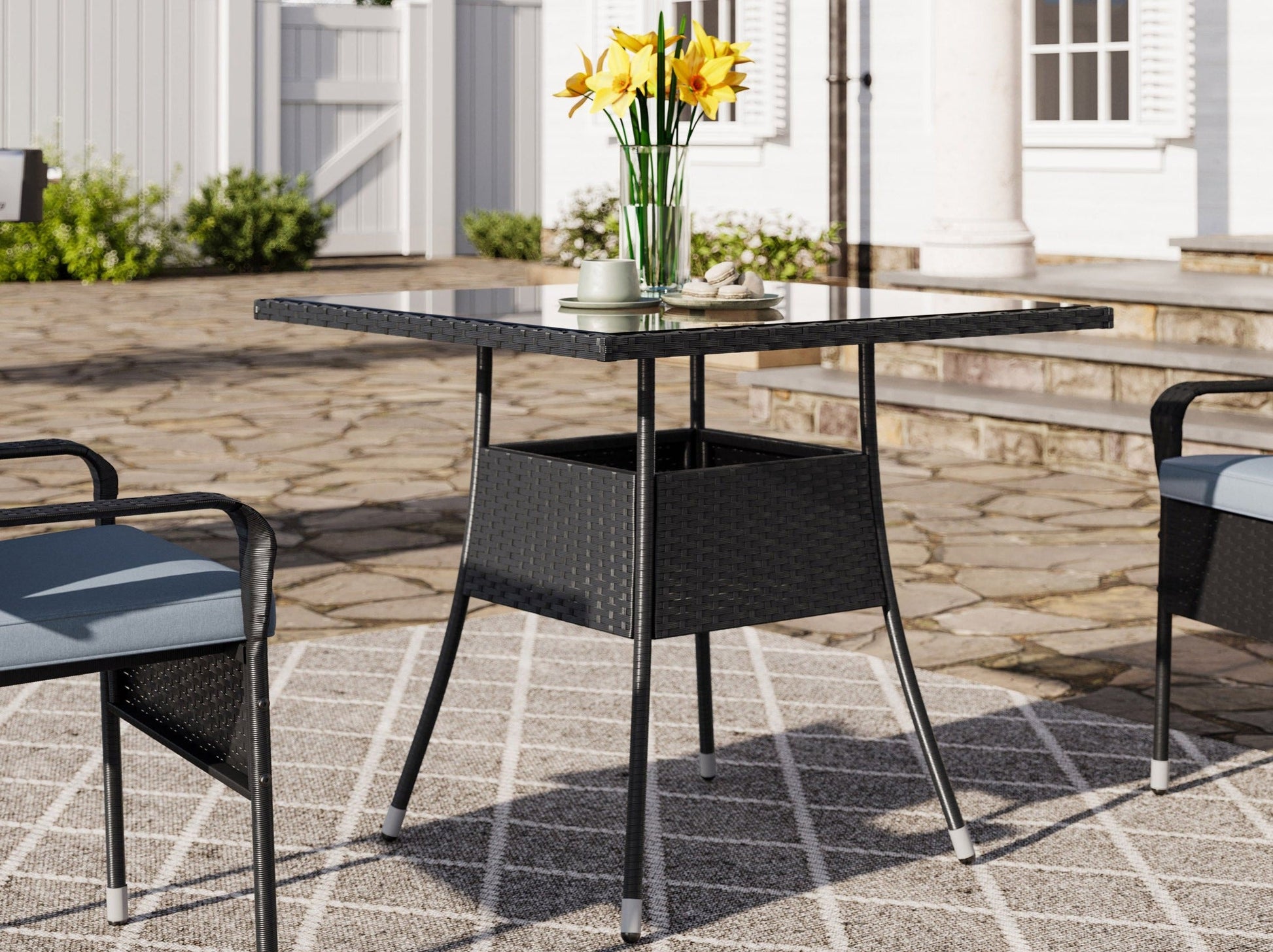 5-piece patio dining set with grey cushions, black metal frame, and a modern design for outdoor dining.