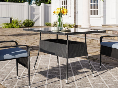 5-piece patio dining set with cushioned chairs, grey woven rattan, and a tempered glass table, ideal for outdoor spaces.