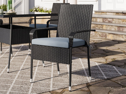 5-piece patio dining set with grey cushions, black metal frame, and wooden tabletop, perfect for outdoor dining.