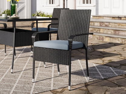 7-piece patio dining set with grey cushions, black metal frames, and a modern design for outdoor spaces.