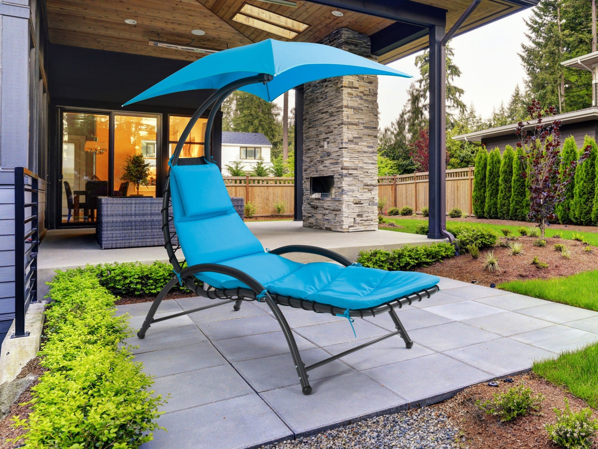 Blue patio lounge chair with canopy, adjustable backrest, and weather-resistant fabric.