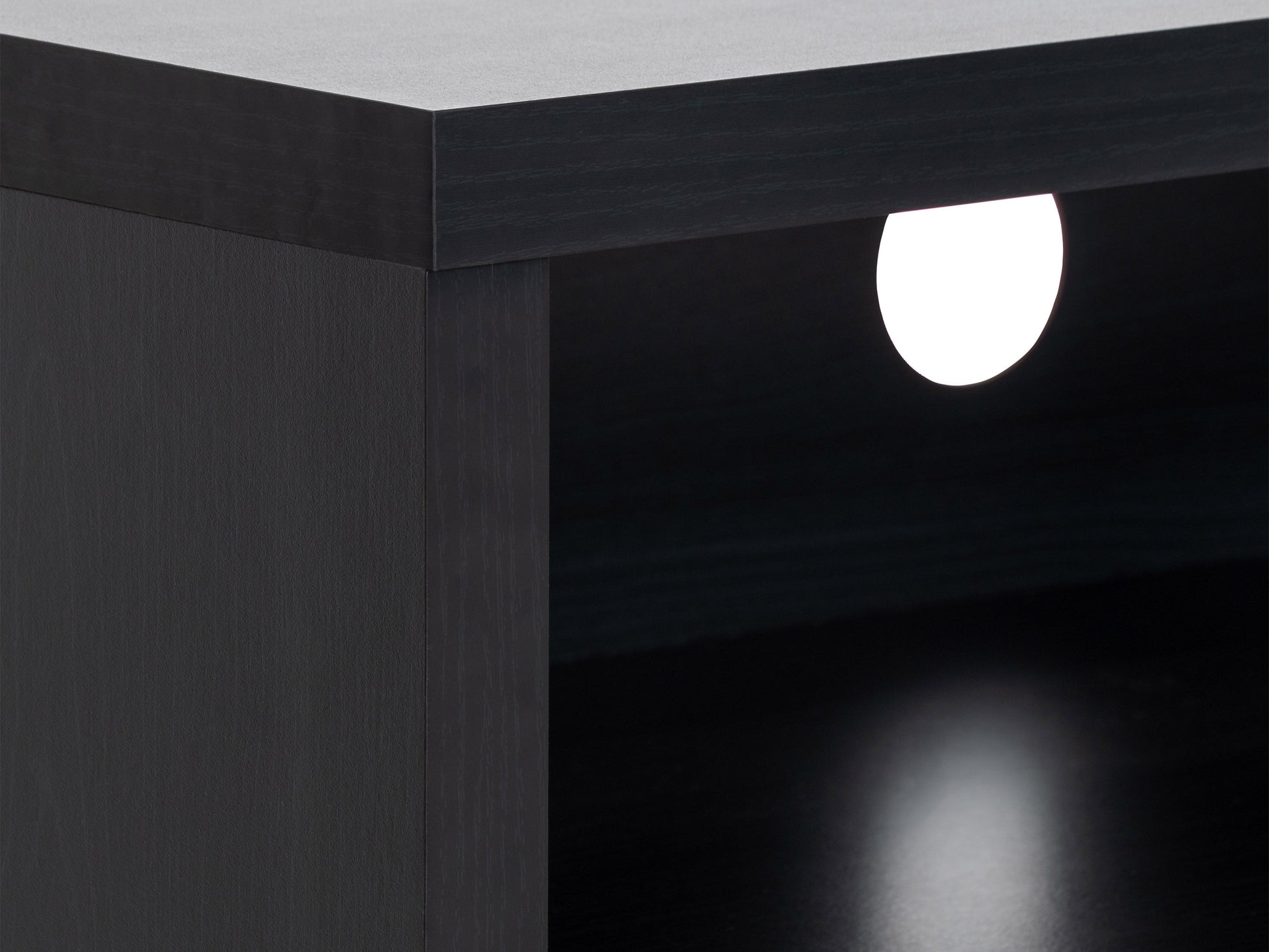 Black TV stand for TVs up to 95 inches, featuring sleek design with open shelves and durable construction.