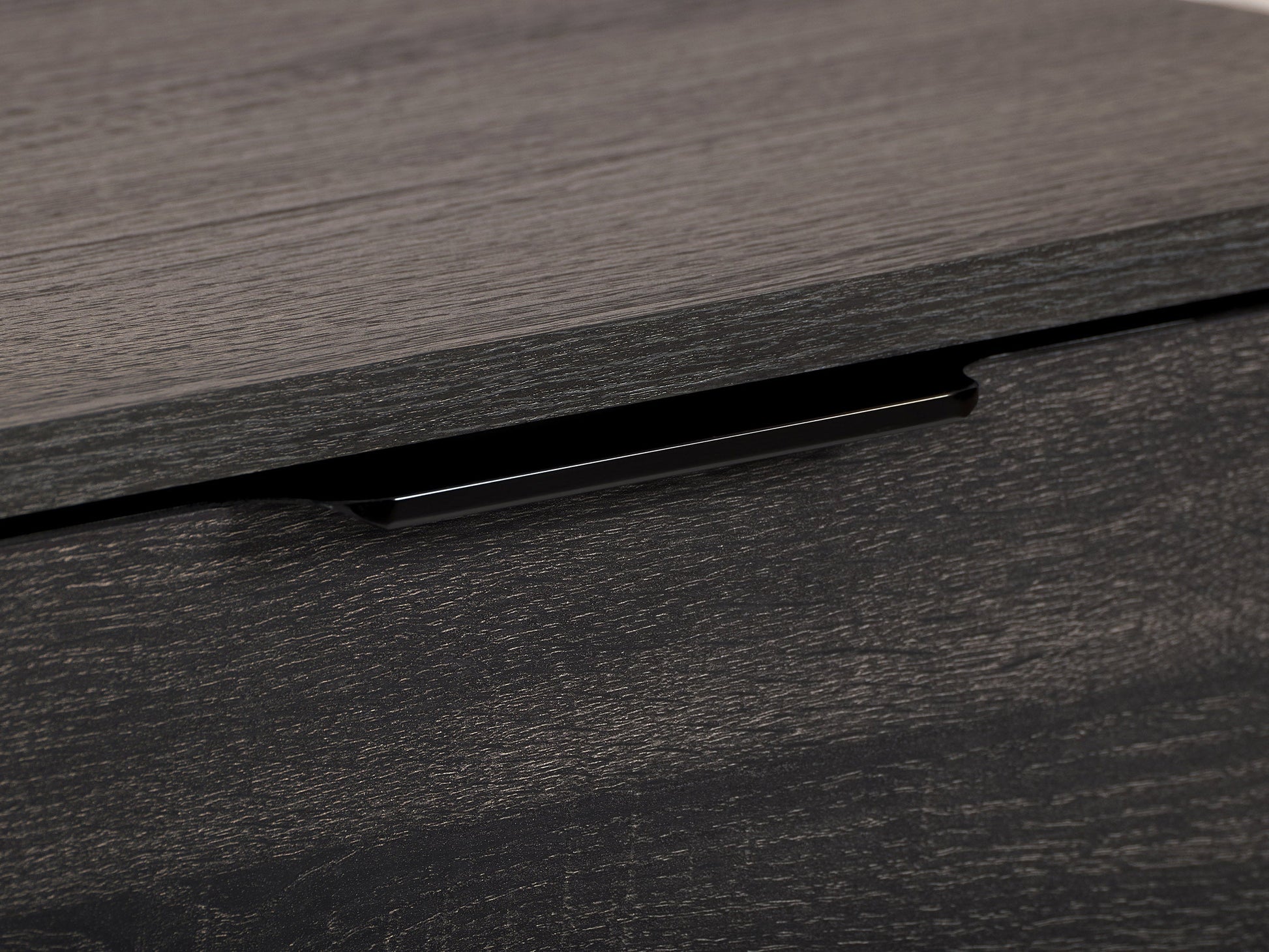 Dark grey TV stand with cabinet storage, fits TVs up to 85", modern design, sleek finish, durable construction.