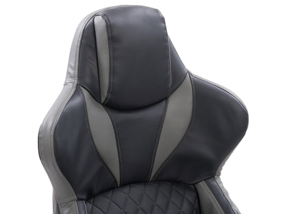 Ergonomic black and grey gaming reclining chair with lumbar support, padded armrests, and sleek design.