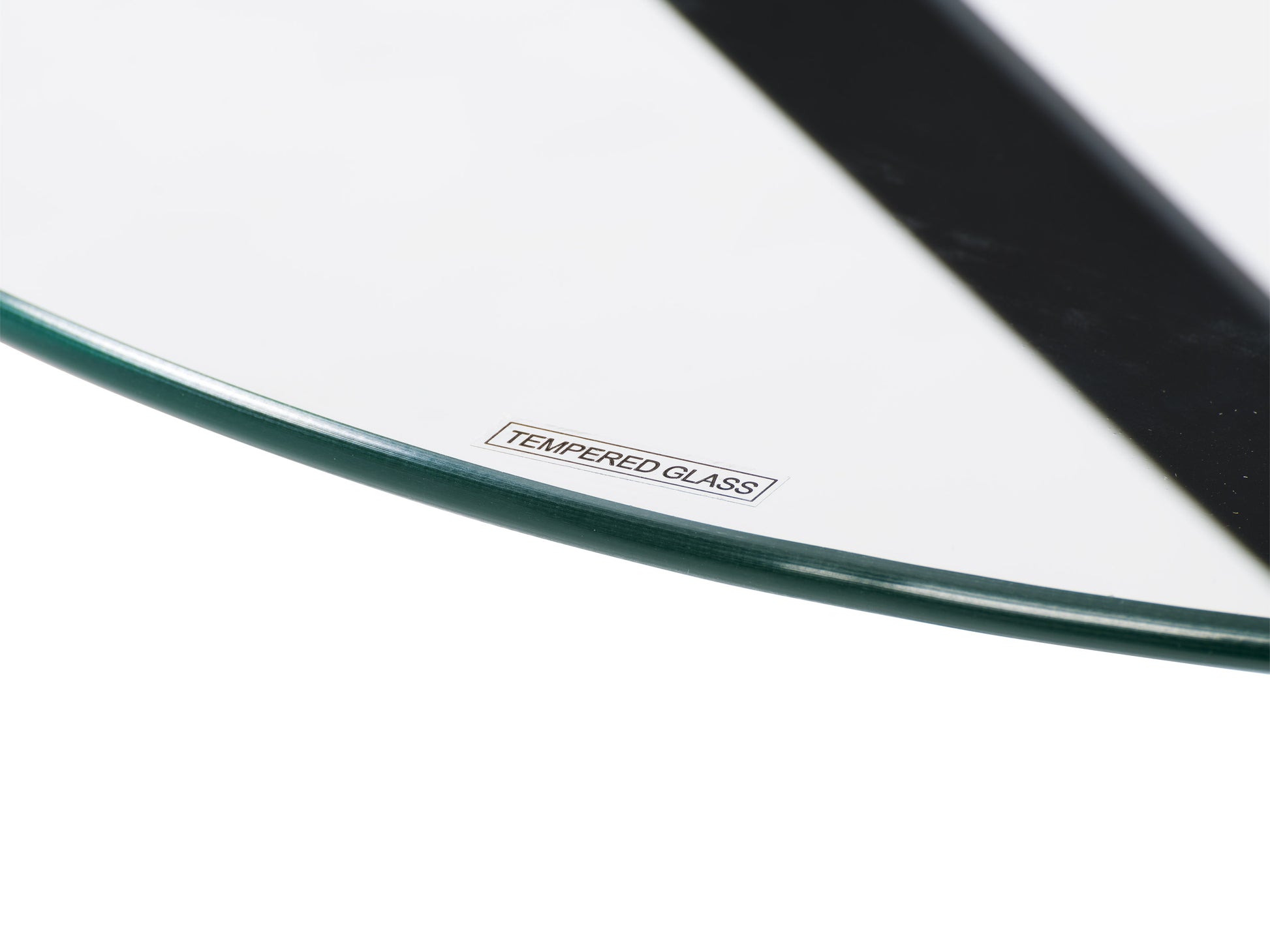 Round glass bistro table with sleek chrome legs, minimalist design, ideal for modern dining spaces, durable tempered glass top, and polished metal frame.