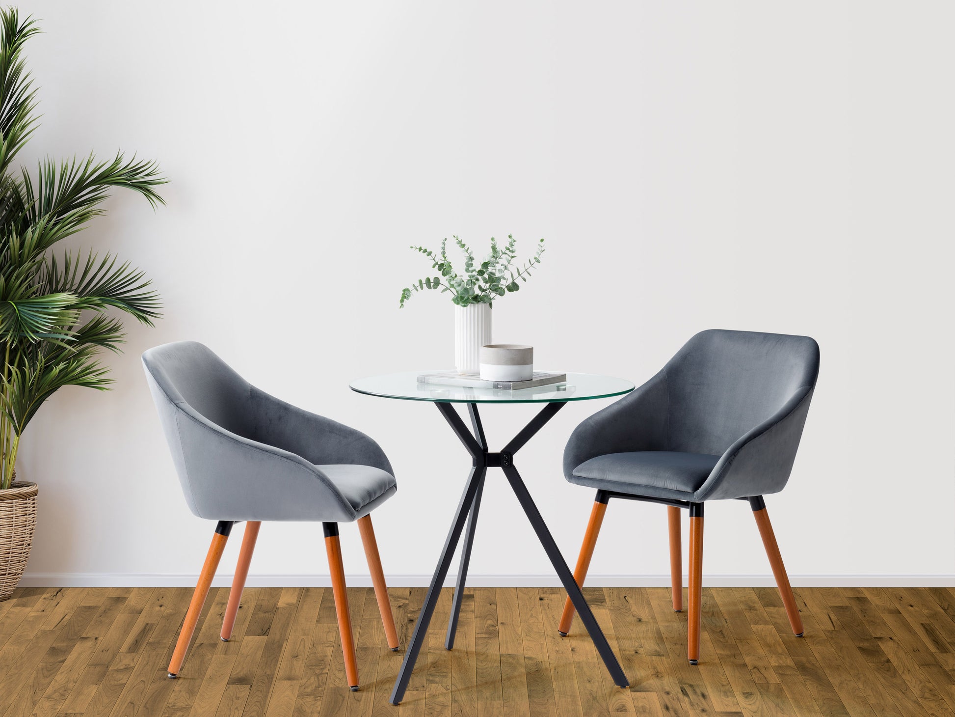 Modern glass bistro dining table with round clear glass top, sleek wooden legs, and minimalist design, perfect for contemporary dining rooms.