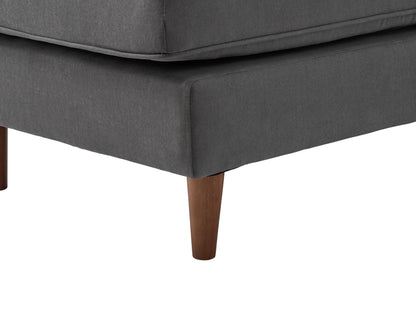 Dark gray sectional sofa with tufted cushions, modern L-shaped design, and sturdy metal legs. Upholstered in soft fabric, featuring a spacious chaise lounge and sleek armrests, perfect for contemporary living rooms.