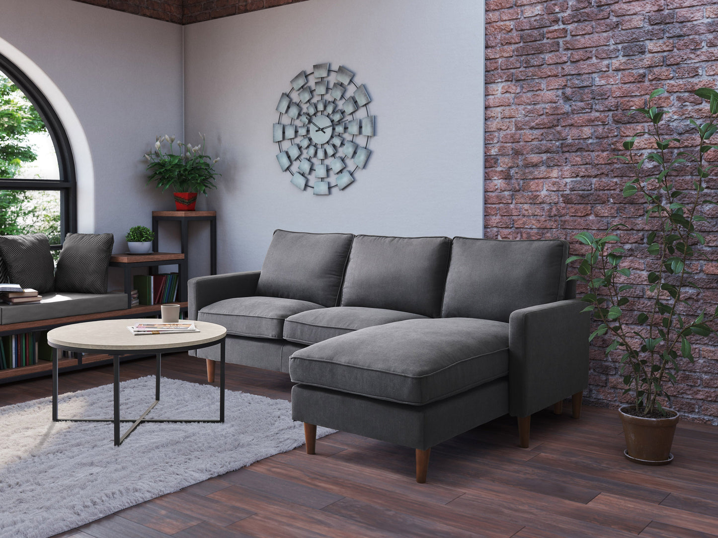 Gray sectional sofa with tufted cushions, chaise lounge, and reversible ottoman. Upholstered in soft, durable fabric with sleek, modern design. Ideal for living rooms, providing comfort and style.