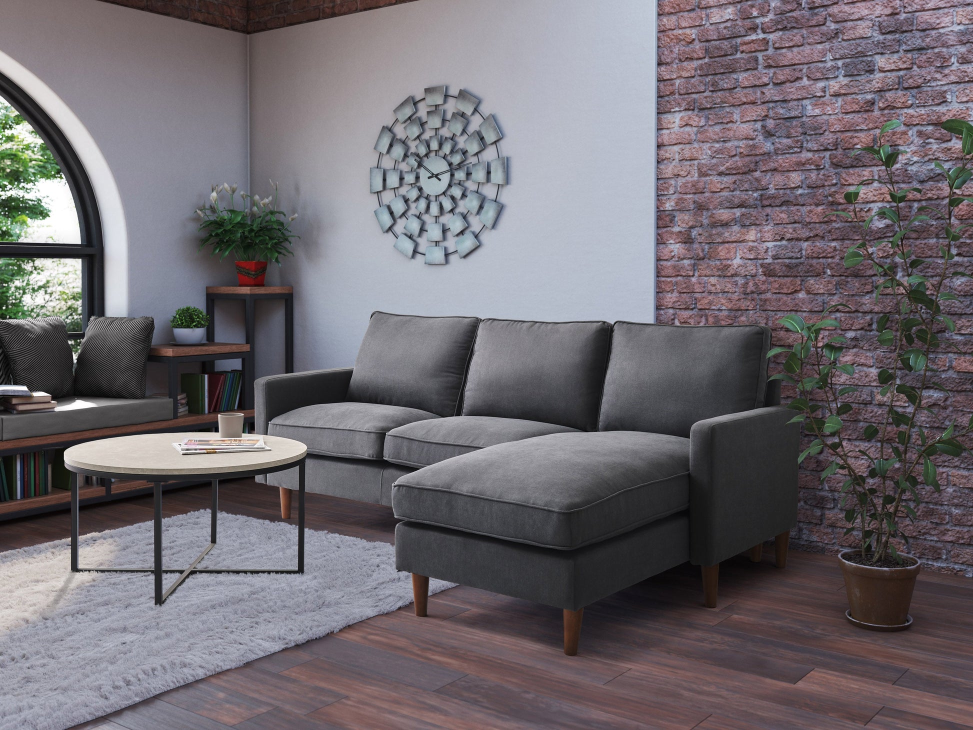 Gray sectional sofa with tufted cushions, chaise lounge, and reversible ottoman. Upholstered in soft, durable fabric with sleek, modern design. Ideal for living rooms, providing comfort and style.