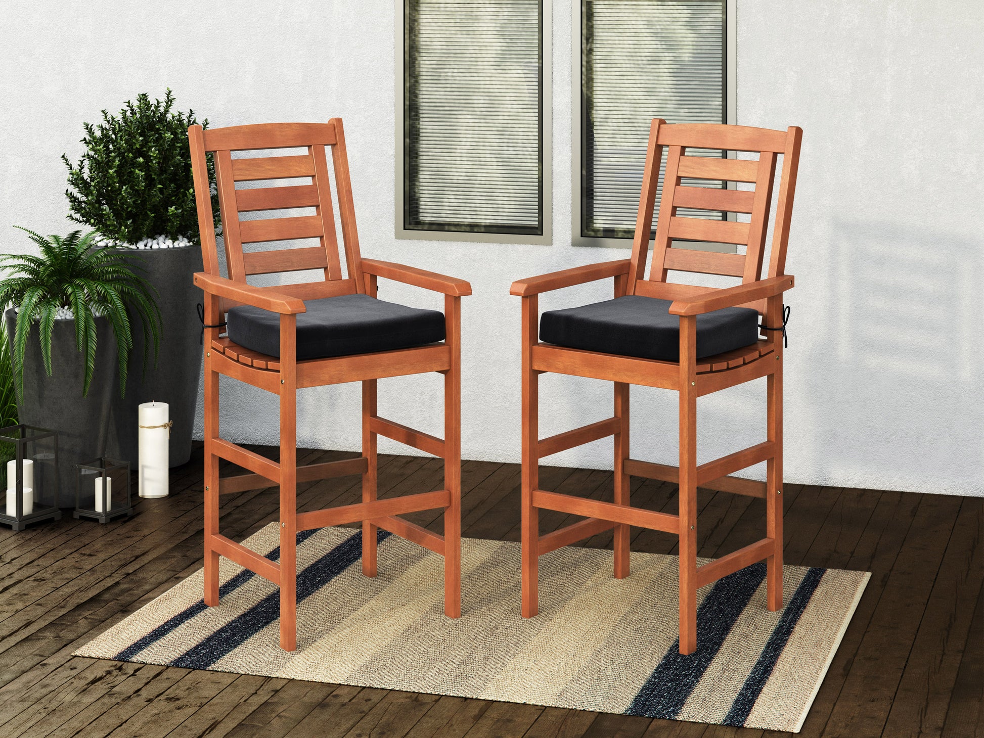 Set of 2 wooden patio bar stools with natural wood finish, featuring curved backrests, slatted seats, and sturdy footrests, ideal for outdoor dining and entertainment.