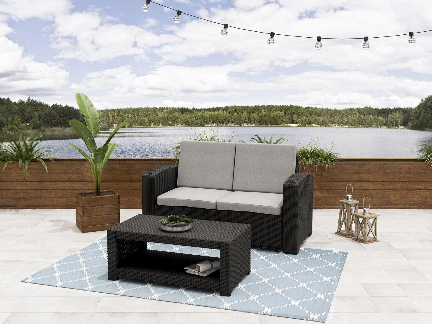 Gray wicker patio conversation set with cushions, featuring a loveseat, two armchairs, and a glass-top coffee table, perfect for outdoor lounging and entertaining.