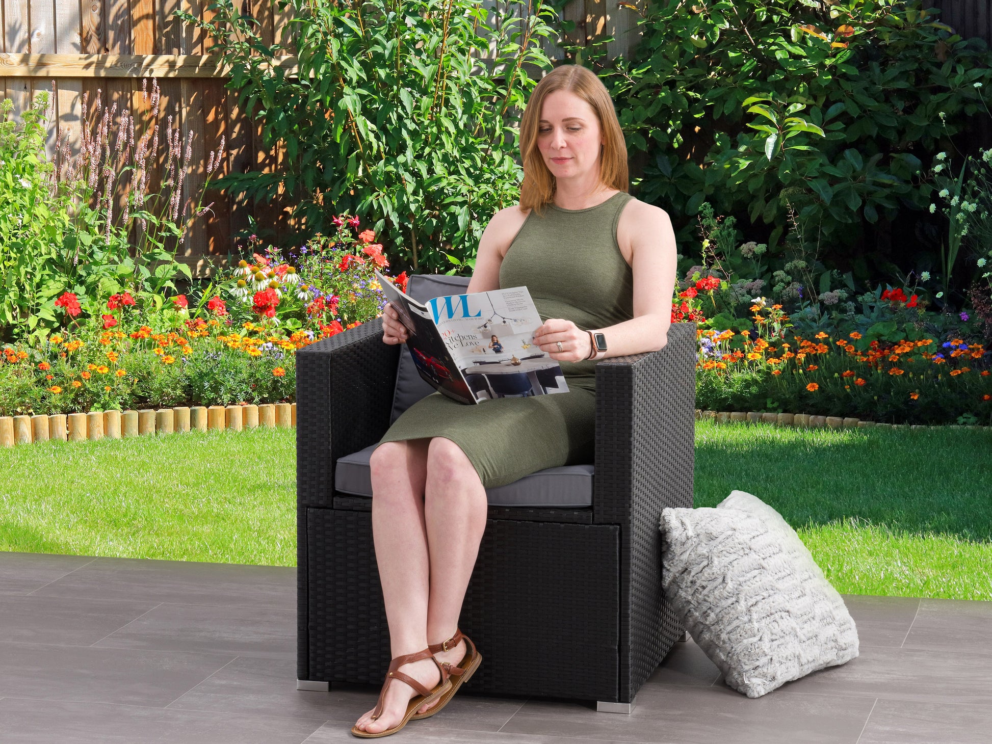 Wicker patio armchair with beige cushions, featuring a sturdy aluminum frame and woven wicker texture. Ideal for outdoor seating, this stylish and durable chair complements any garden or patio decor.