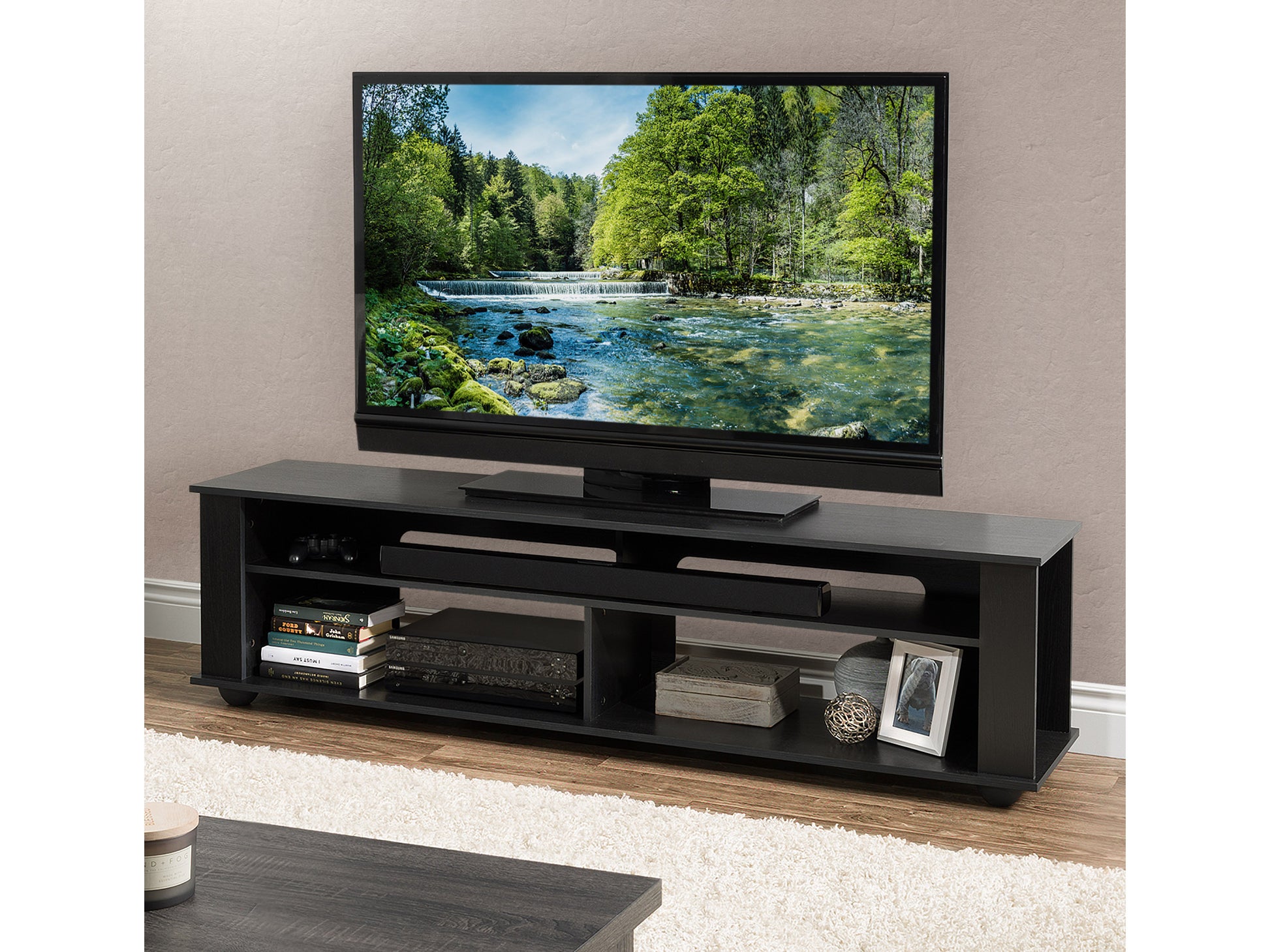 Modern wooden TV stand with open shelving and two drawers in a light oak finish, featuring a sleek design and black metal legs. Ideal for contemporary living rooms, providing ample storage for media equipment.