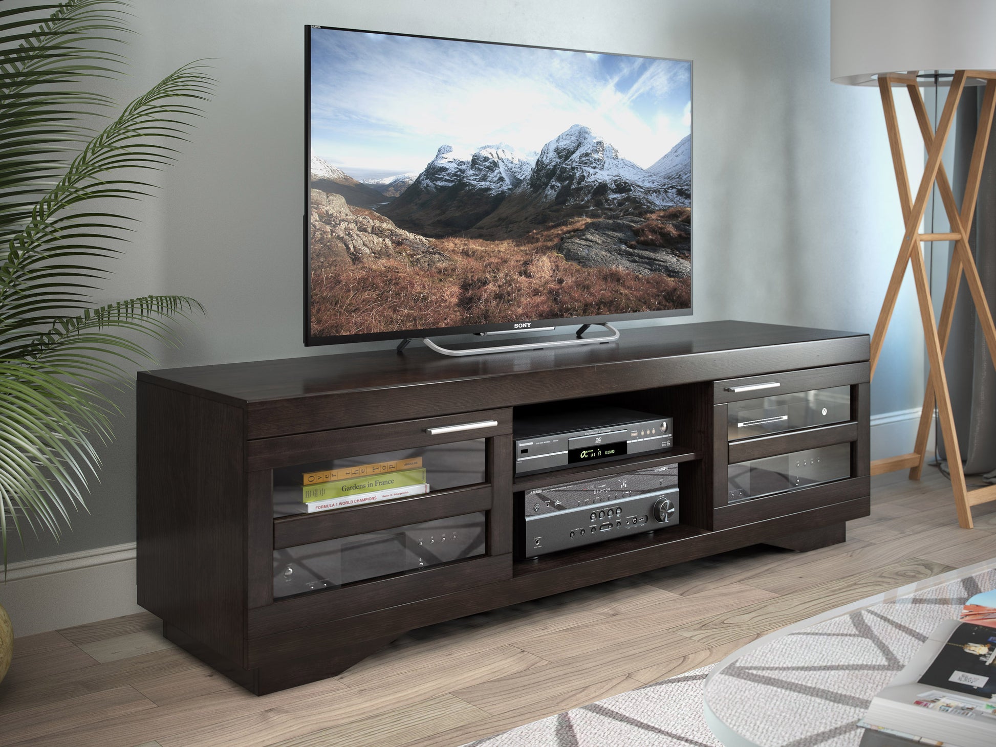 Modern TV stand for TVs up to 85 inches, featuring a sleek black finish with wood accents, spacious shelving, and cable management system, perfect for contemporary living rooms and media centers.