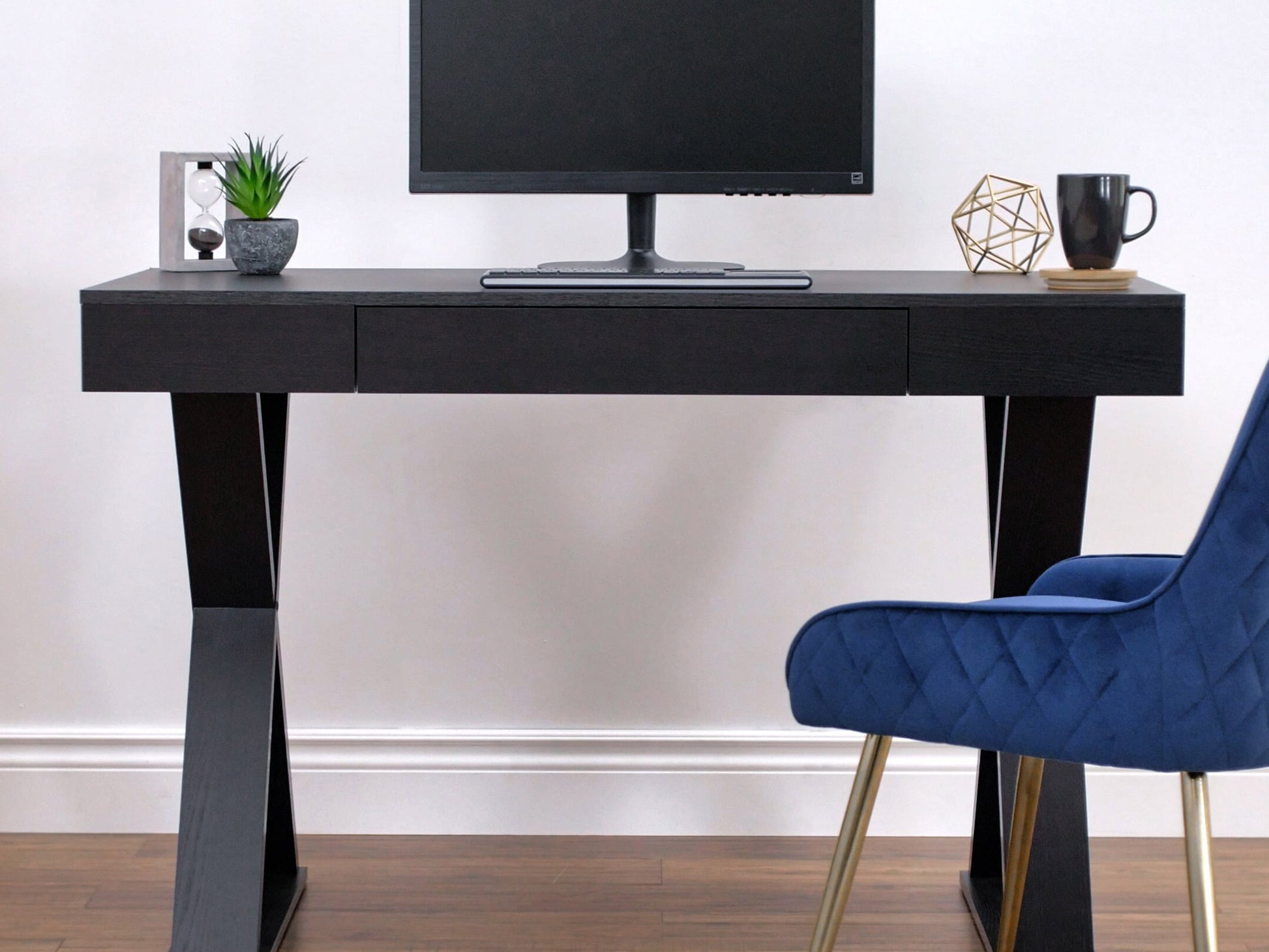 Rustic farmhouse desk with distressed wood finish, featuring a spacious tabletop, two drawers with metal handles, and sturdy legs, perfect for home office or study.
