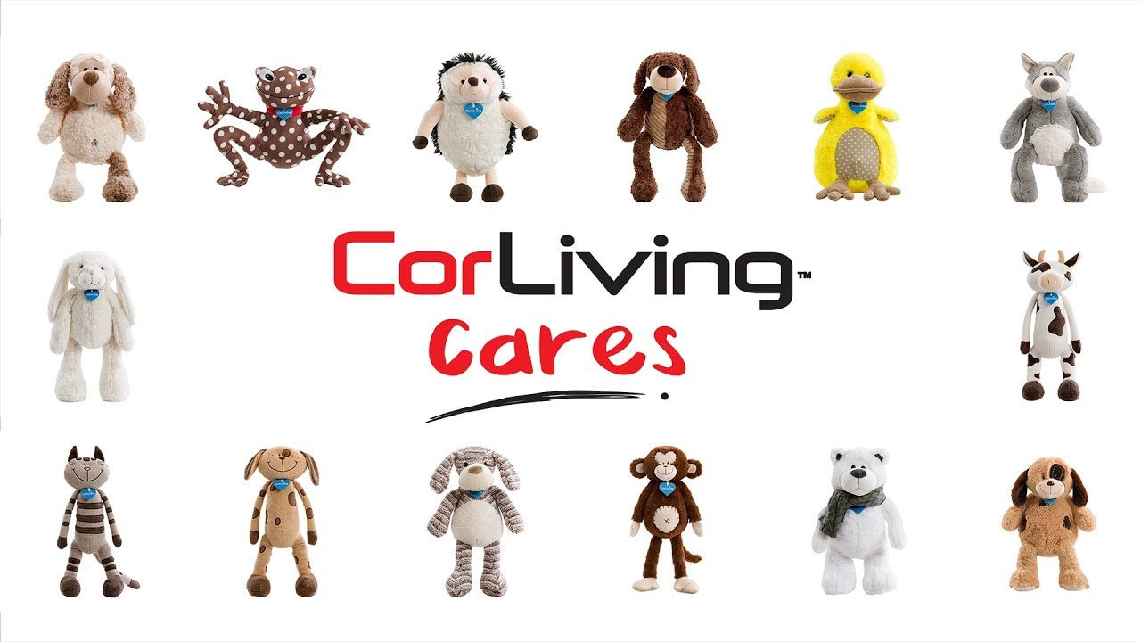 Charity plush dog toy, Reggie, with soft brown and white fur, floppy ears, and a friendly expression, designed to support CorLiving Cares initiative.